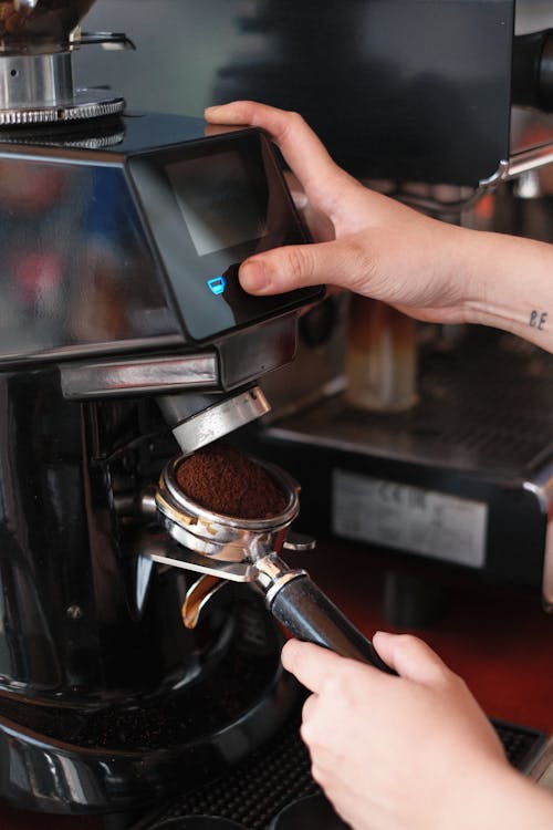 Free Person using a Coffee Machine Stock Photo