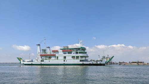 A Ferry Boat with Cargo Cruising in the Sea