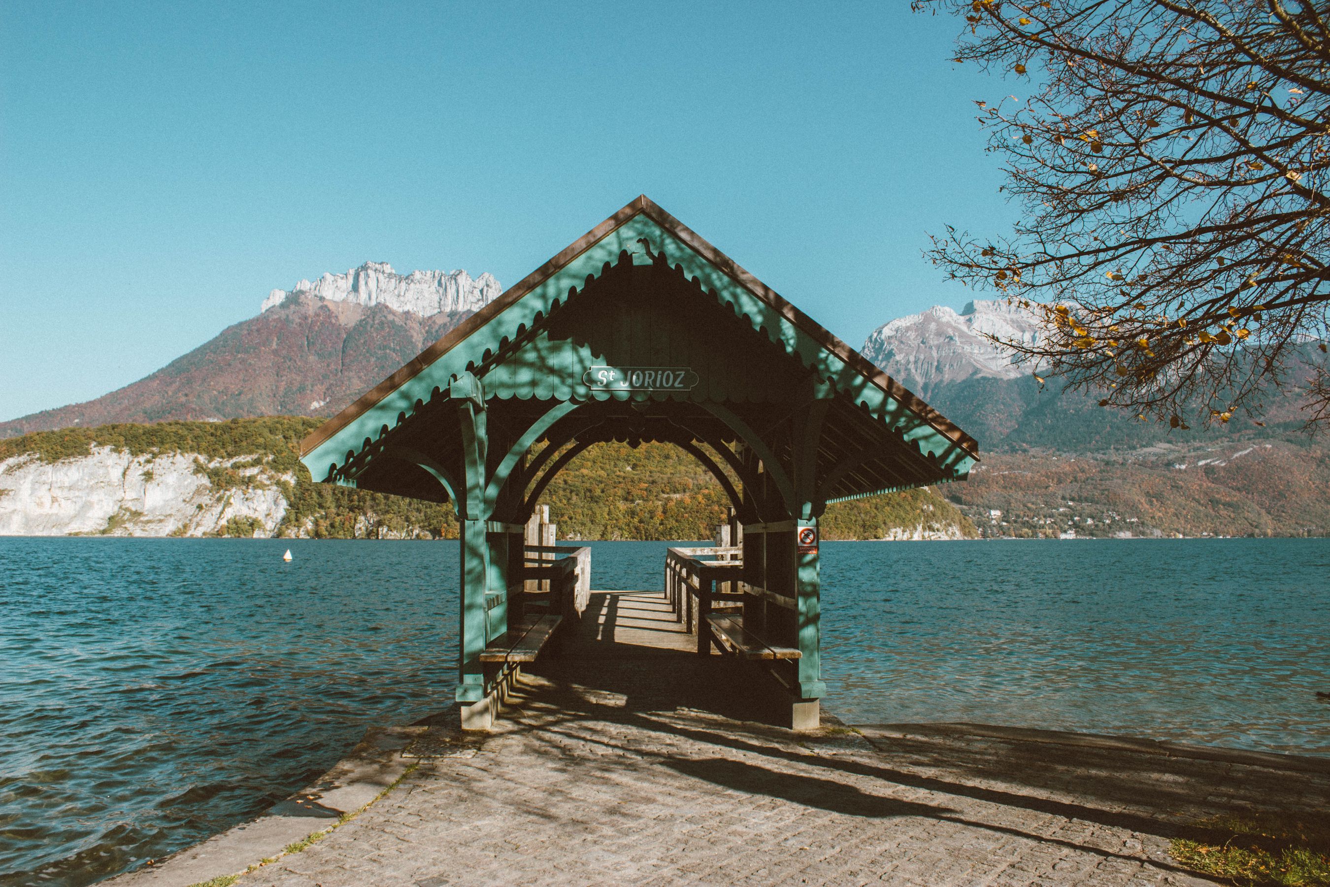 Geneva 3 day itinerary day trip — Lake Annecy pier and mountain backdrop