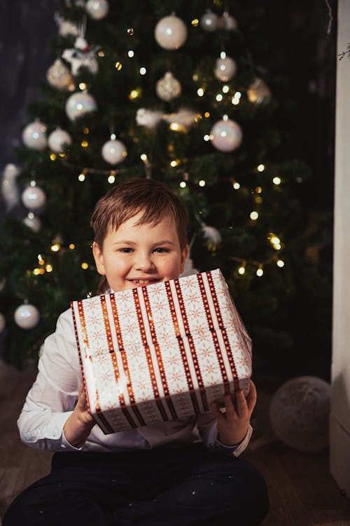 Kid Holding a Christmas Gift