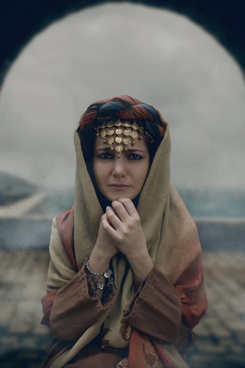 Free A Sad Woman Wearing Headscarf Looking at the Camera Stock Photo