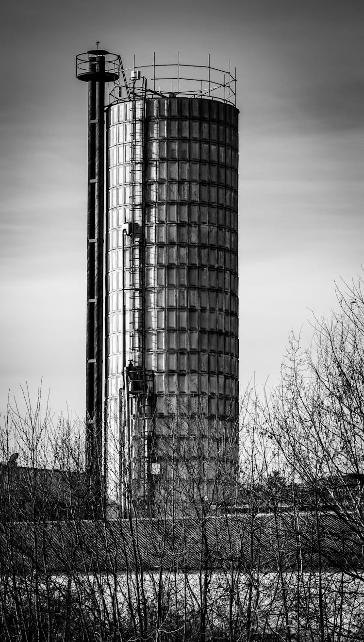 A Grayscale Of A Tower Silo