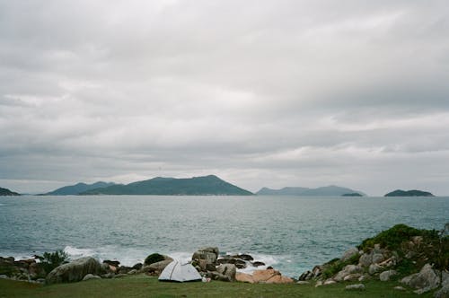 Free Tent on Rocky Coast Stock Photo