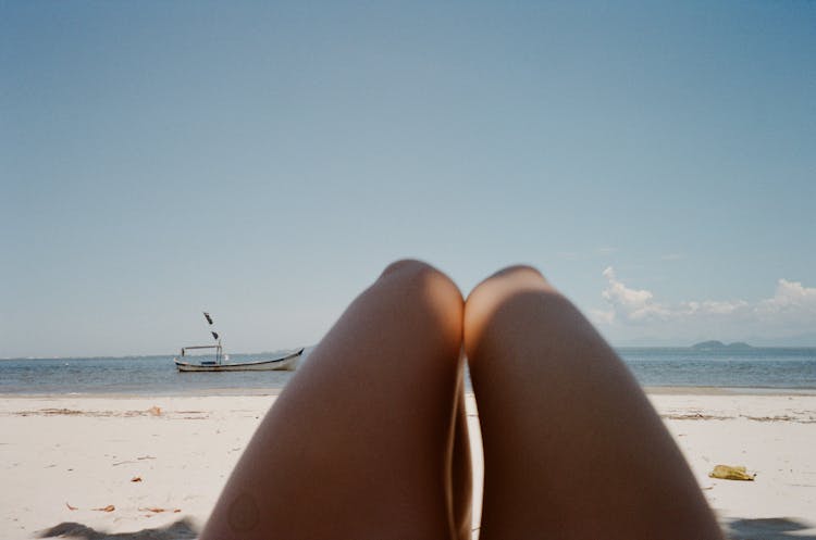 Legs On Beach At Vacation