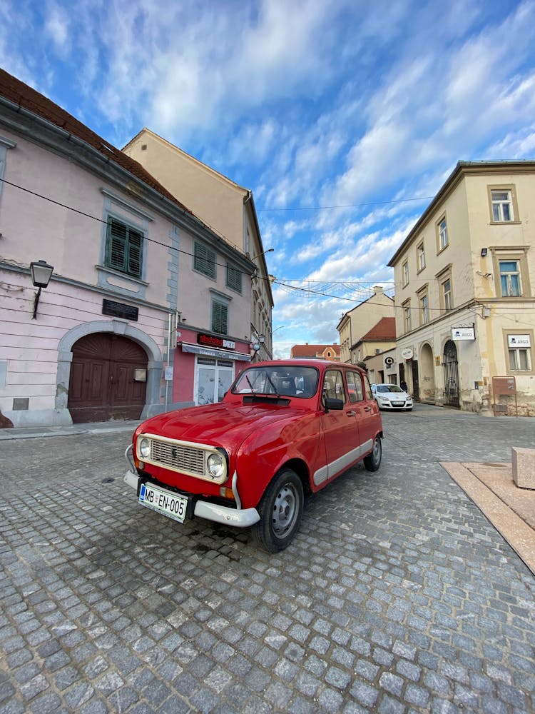 Red Car On Cobblestone Street