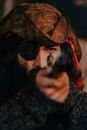 A Bearded Man with a Brown Hat and an Eye Patch