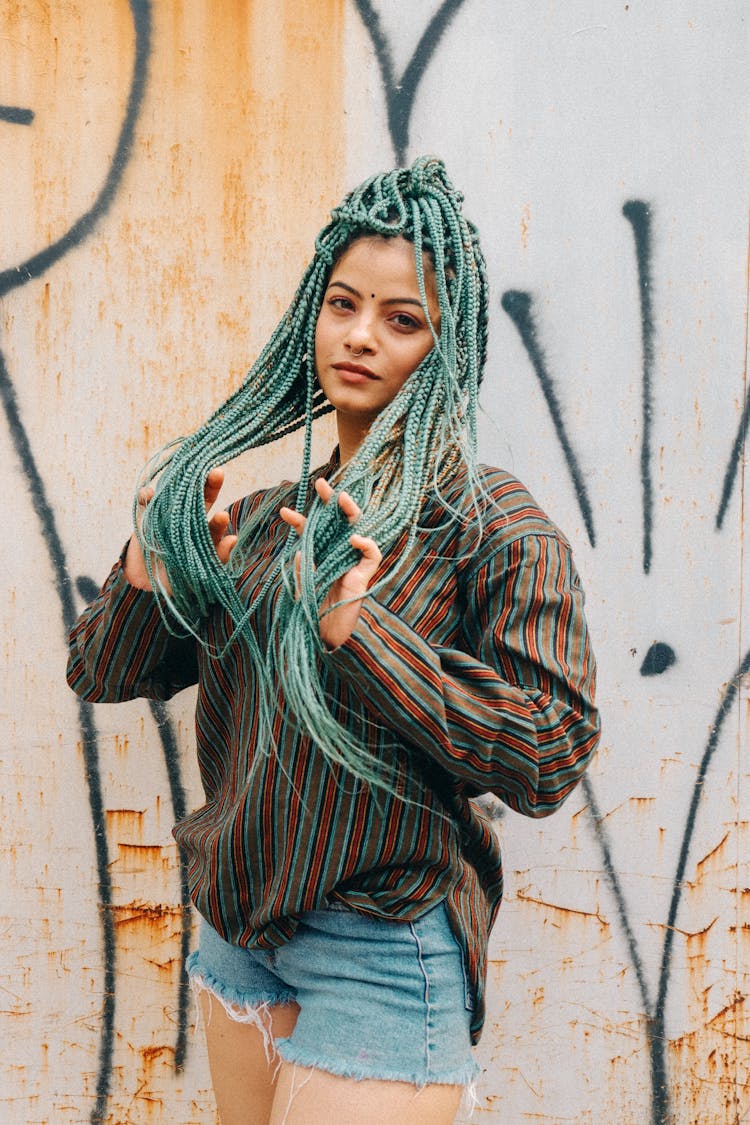 Teenage Girl With Long Green Coloured Braided Hair