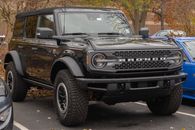 Black Jeep Wrangler Parked on Gray Asphalt Road