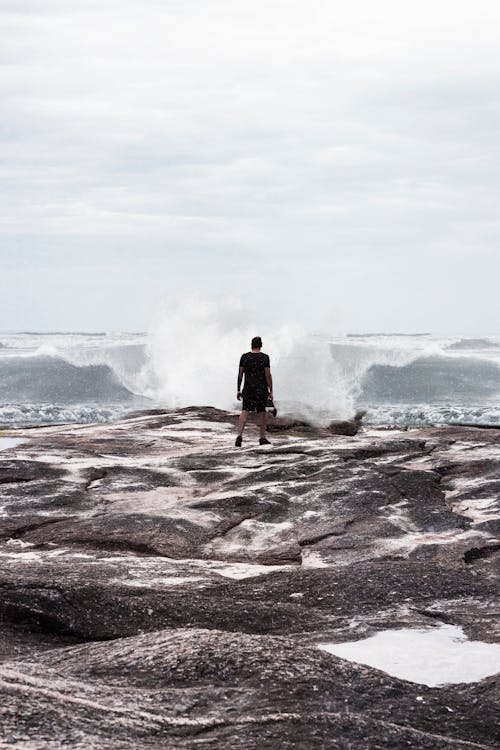Free Person Standing on Coast  Stock Photo