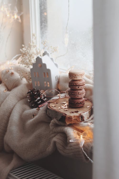 Macaroons Stacked on a Wooden Board