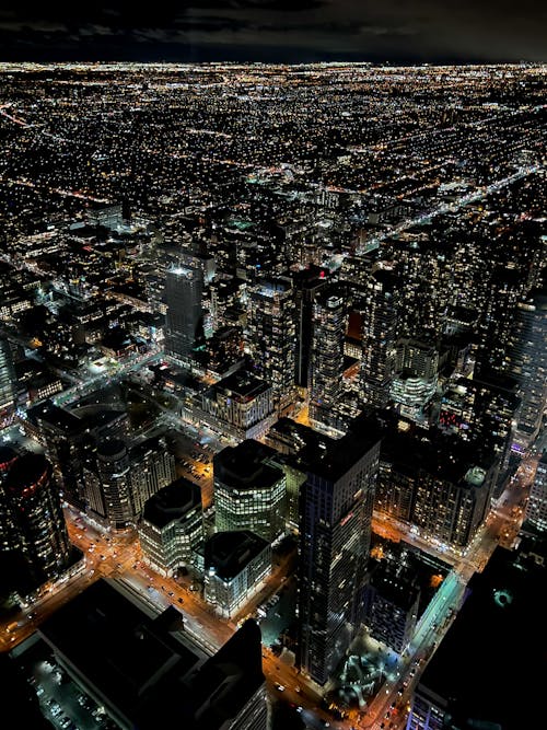 Aerial View of City Buildings during Night Time
