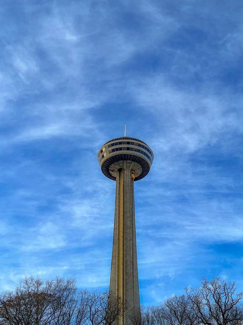 Free Skylon Tower on a clear day with a blue sky backdrop. Perfect for travel and architecture themes. Stock Photo