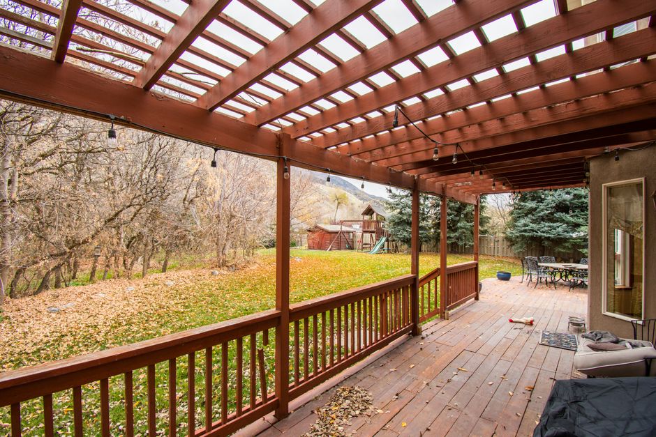 Deck Staining in Springfield, MO: Oil vs. Water-Based Stains and When to Restain 2 Evenly stained deck with rich wood tone and protective finish