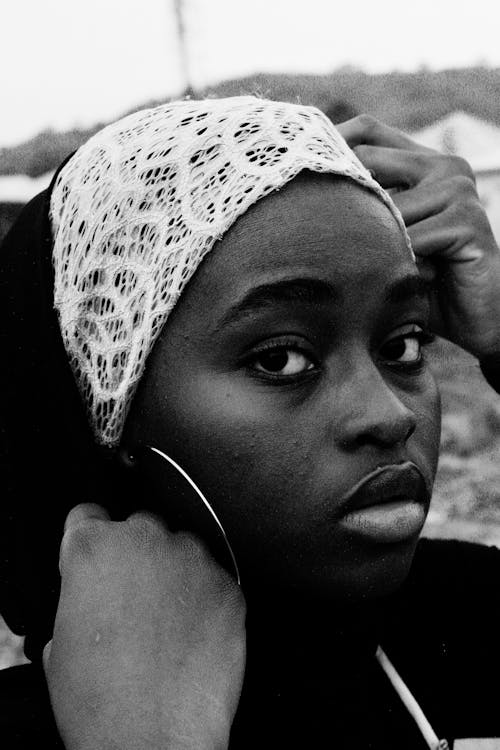 Black and White Photo of a Girl Wearing Headscarf