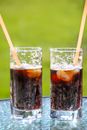 Two Glasses With Beverage and Straws