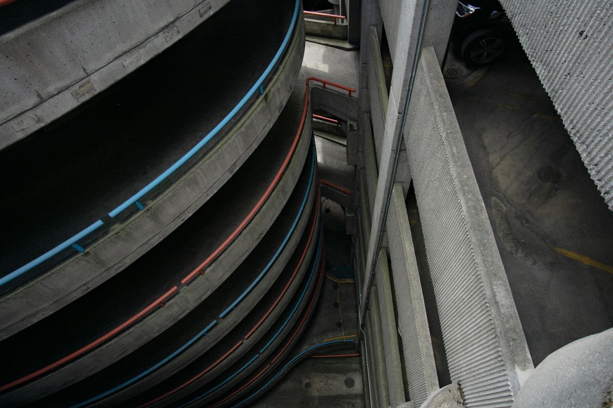 High-angle view of the spiral ramps of a concrete parking garage