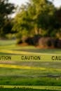 Caution Tape on a Lawn