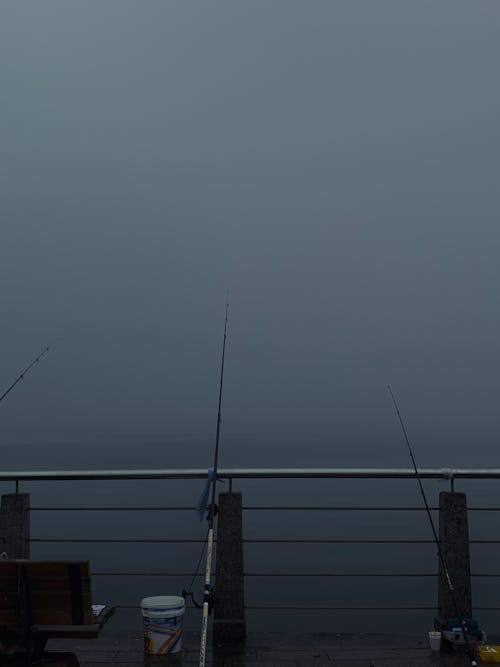 Fishing Rods on a Metal Railing