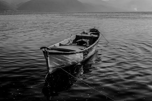 

A Grayscale of a Boat on the Ocean