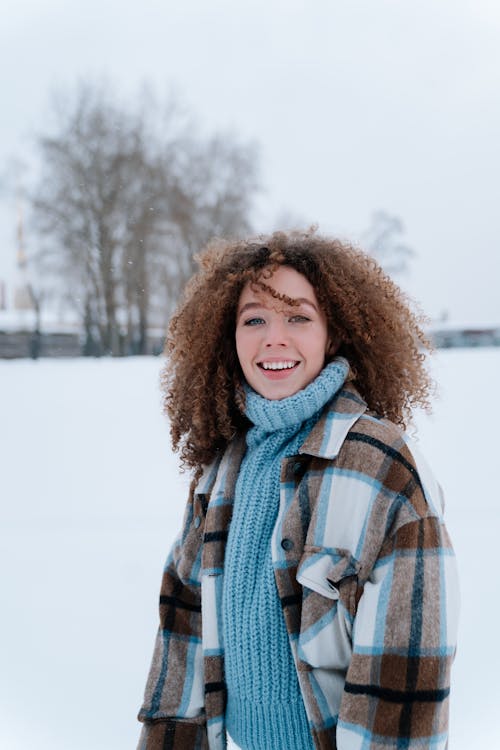 Beautiful Girls with Curly Hair in Warm Cozy Winter Clothes Stock