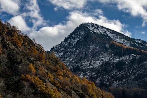 Green and Gray Mountain Under White Clouds and Blue Sky