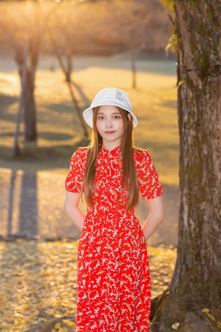 Pretty Girl Wearing Red Floral Dress And White Fedora Hat