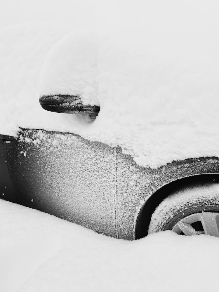 Car Covered In Snow