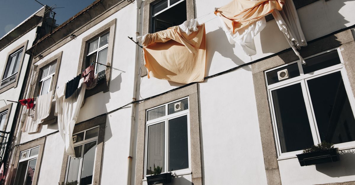 colorful Porto street with laundry hanging from windows, Portugal