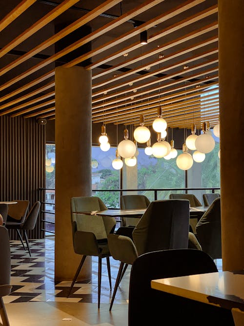 A Restaurant with Brown Themed Interior Design Paired with Green Chairs