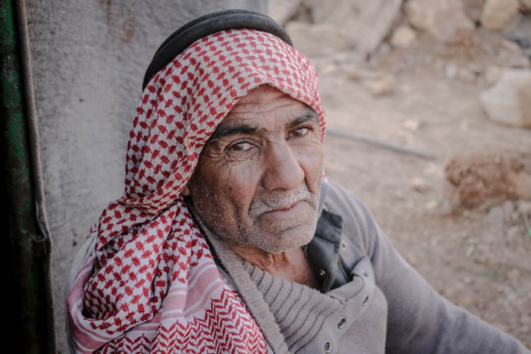 An Elderly Man Wearing A Keffiyeh With Agal