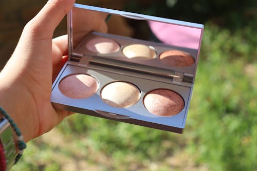 A Person Holding a Blush Palette with Mirror