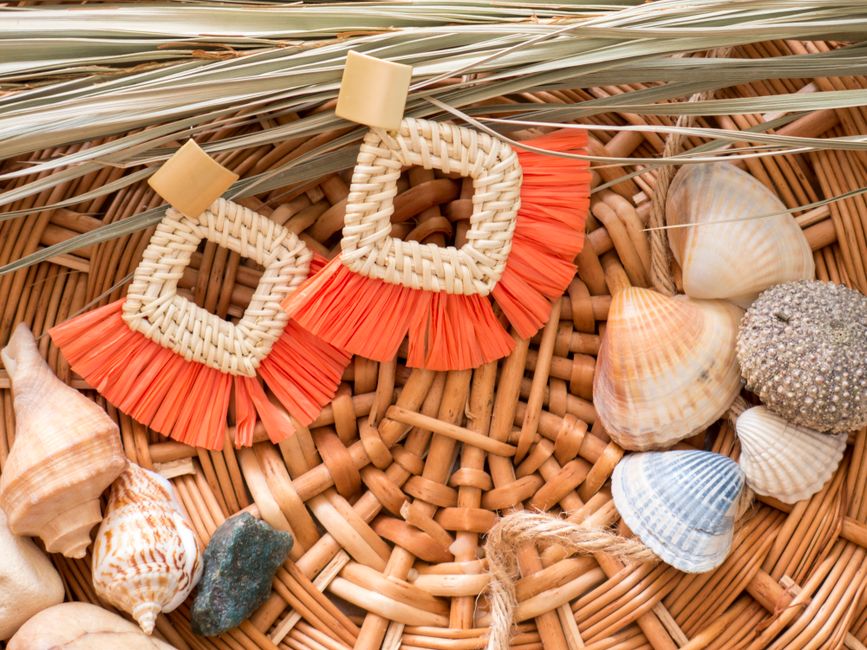 luxury coastal accessories featuring rattan and artisanal glass - luxury beach house interior design