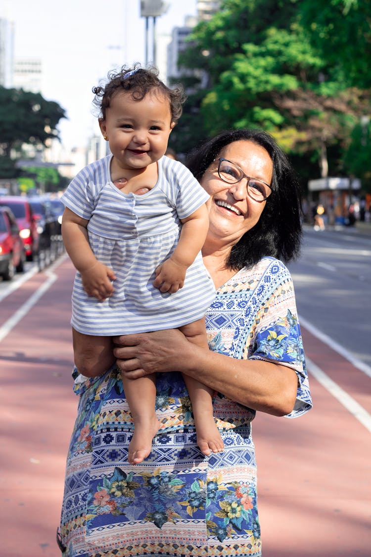 Laughing Grandmother Holding Her Grandchild