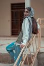Selective Focus of a Woman Leaning on Guardrails