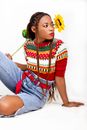 Woman in Red and White Striped Long Sleeve Shirt and Blue Denim Jeans
