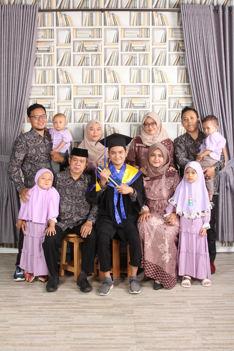 Portrait Of A Graduate With His Family