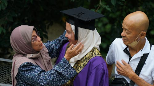 Parents Greeting Daughter University Graduate