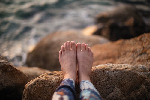 Free Close Up Photo of Feet on Rock Stock Photo