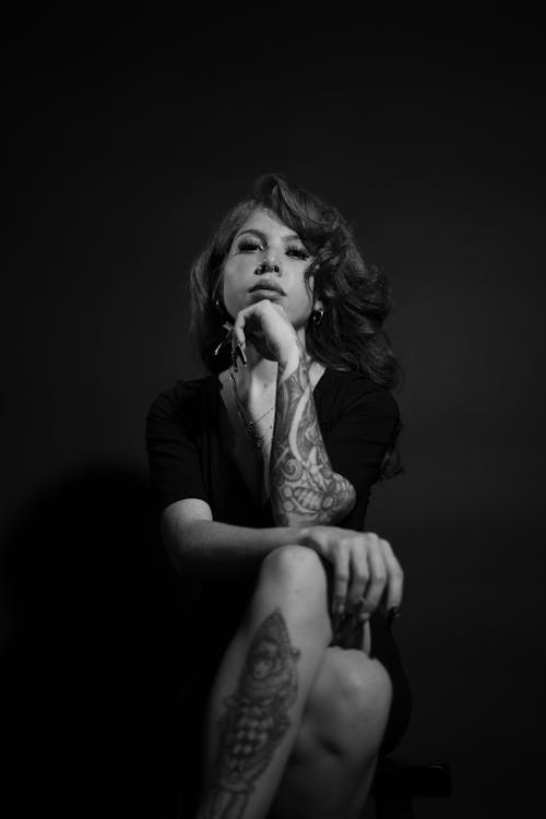 Free Grayscale Photo of a Tattooed Woman in Studio Shoot Stock Photo