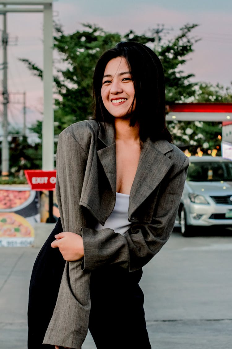 Selective Focus Of A Woman Wearing Her Grey Blazer