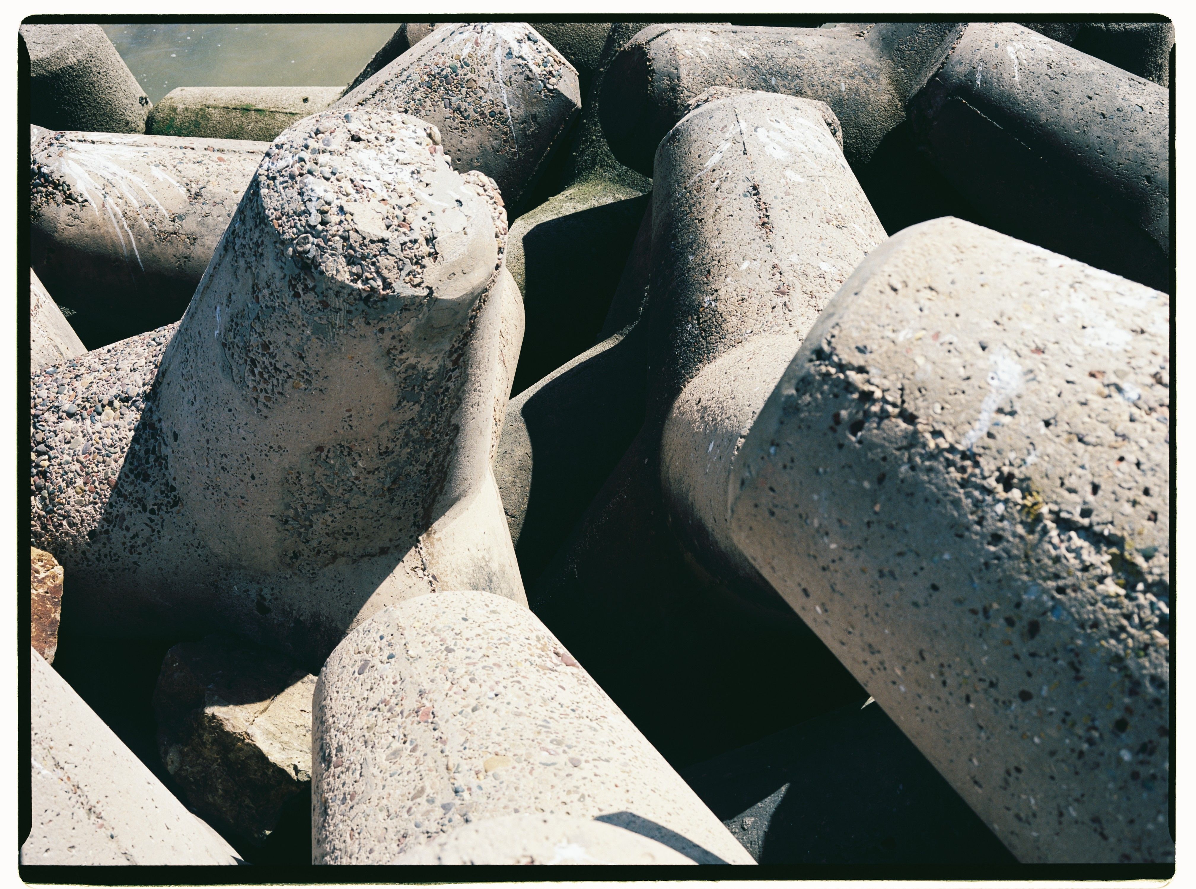 Detailed shot of rugged concrete tetrapods by the water in Morocco.