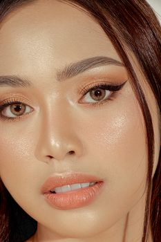 A detailed close-up of a woman showcasing natural beauty and flawless skin.