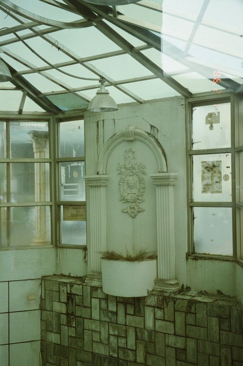 Free A vintage indoor space with classical architecture and glass ceiling. Stock Photo