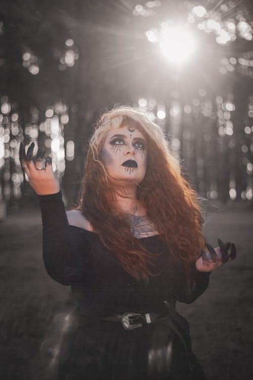 A Woman in Black Dress with Creepy Makeup