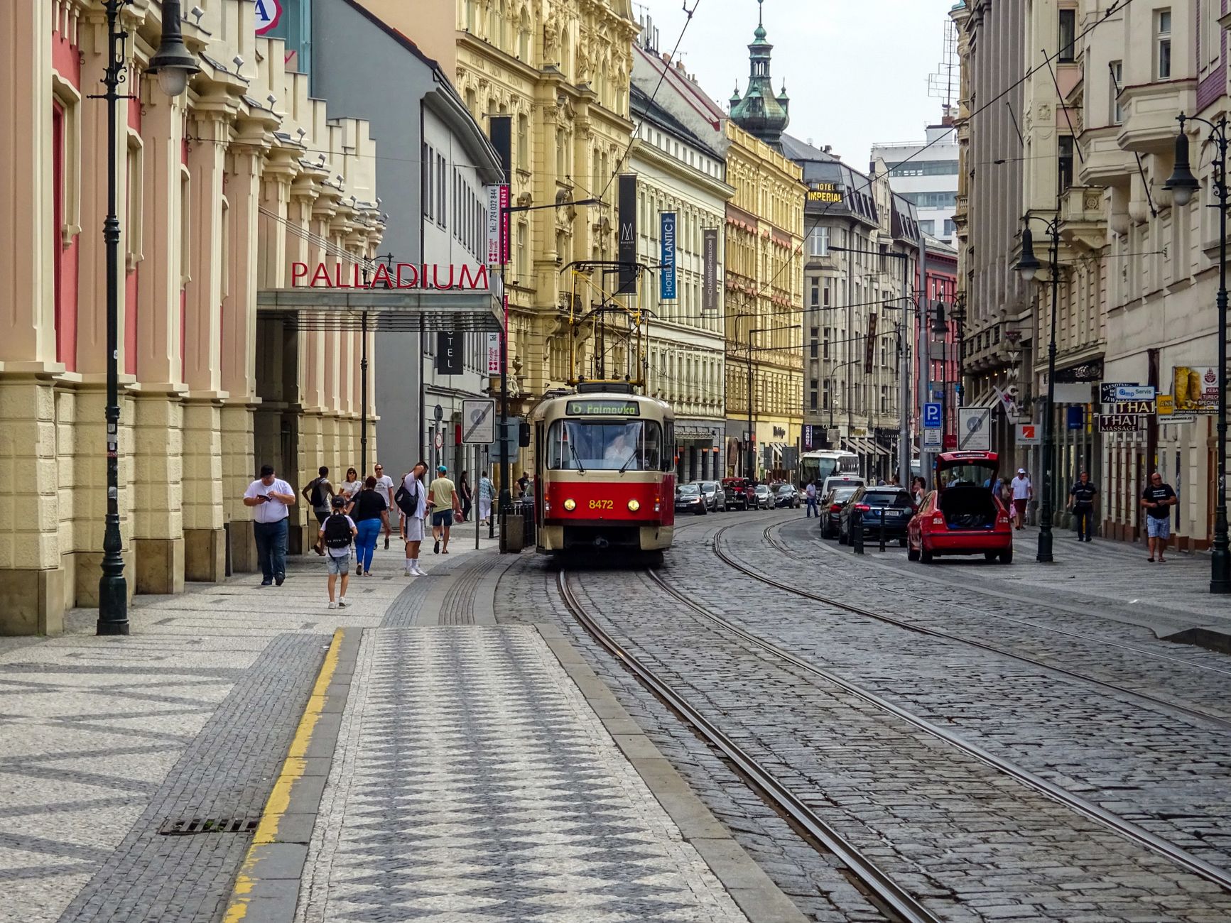 Urban scene featuring a classic tram in Prague's charming old town.