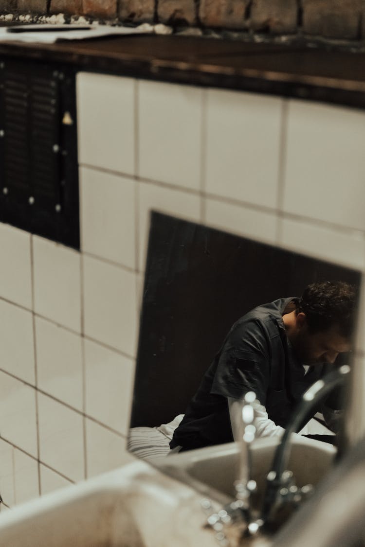 Reflection Of A Man On The Mirror 