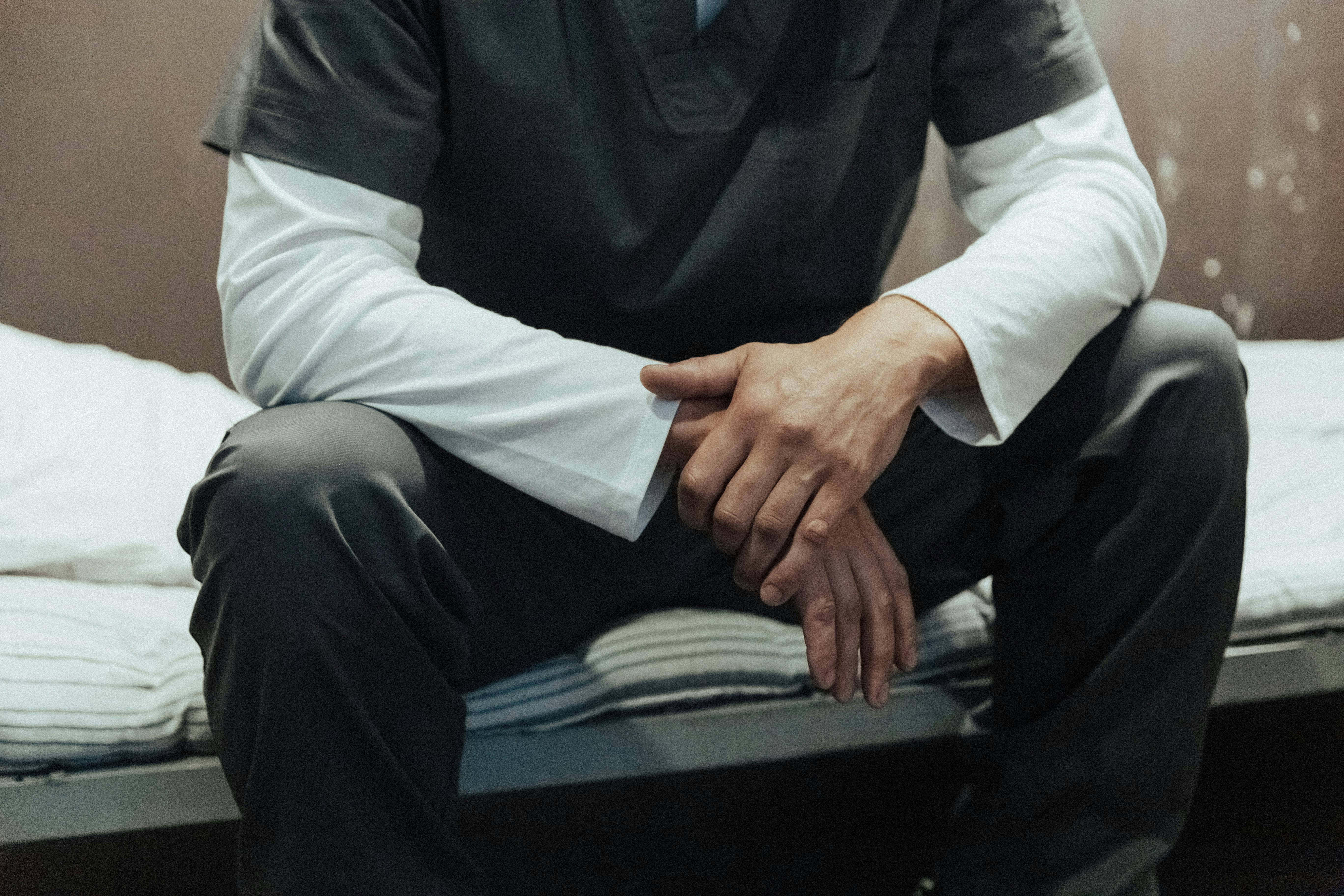 prisoner sitting in cell