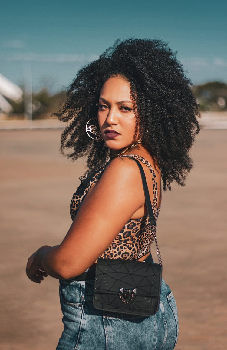 Woman In Leopard Print Top Looking Over Shoulder