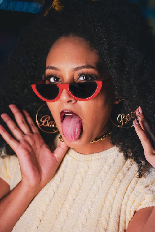 Man with Sunglasses Sticking out her Tongue