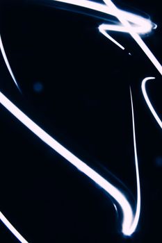 Abstract photo of vibrant light streaks against a black background, offering a dynamic and modern look.